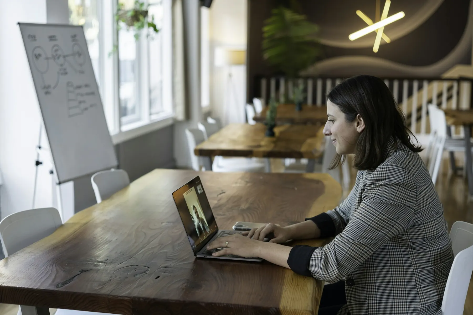 An employee on a live video call with her coach
