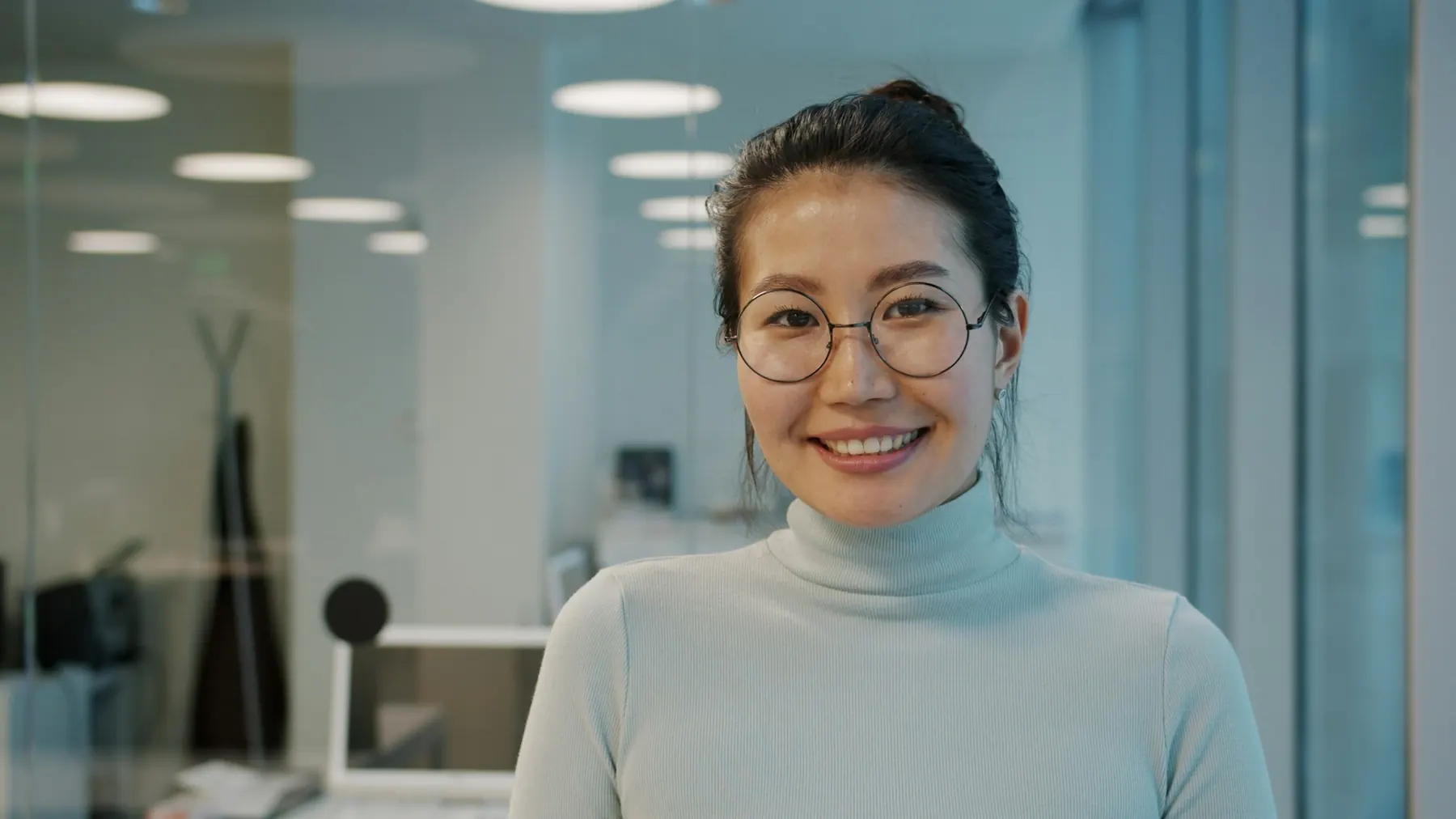 A smiling HR professional in an office